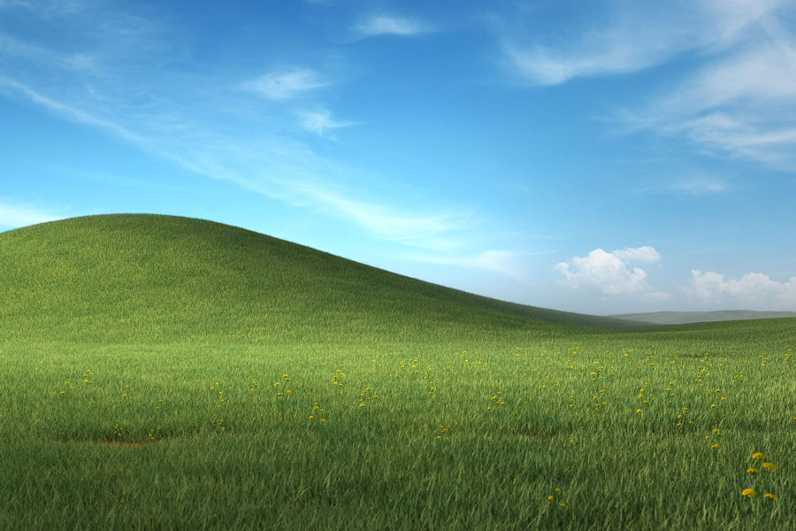 Green hills with a blue sky - the Windows XP desktop image